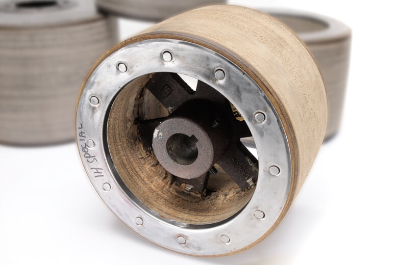 Paper pulleys are made from compressed paper fibers and are formed with metal in the center. 
